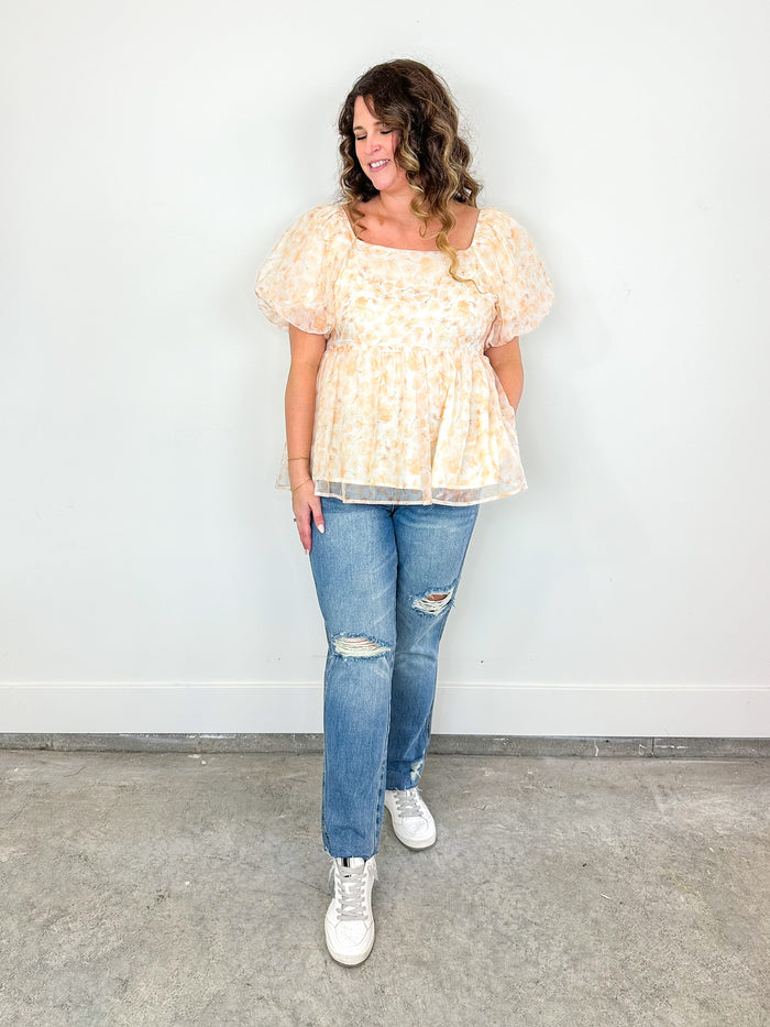 Wearing the Peach Fuzz Peplum Top with the Michelle Judy Blue Jeans